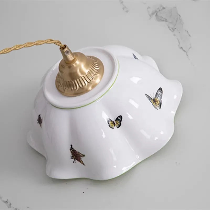 Applique murale fleur avec papillons en céramique