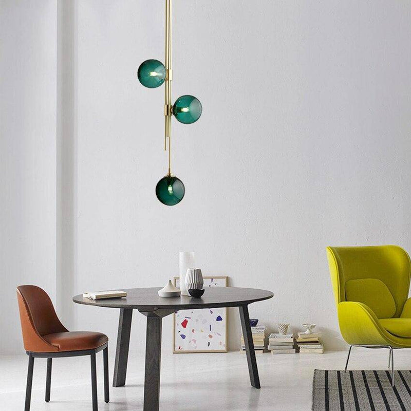 Suspension tube doré et boules en verre moderne