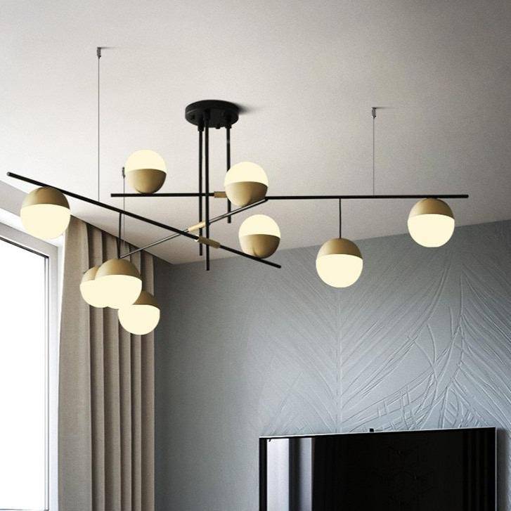 Lustre design avec branches et boules en verre et métal doré