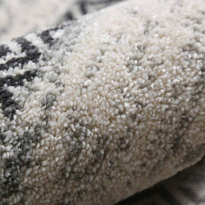 Tapis rond gris et noir aux motifs géométriques Nordic