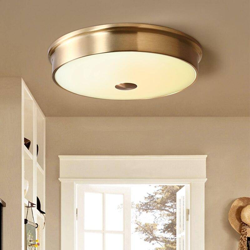 Plafonnier design LED rond en métal doré