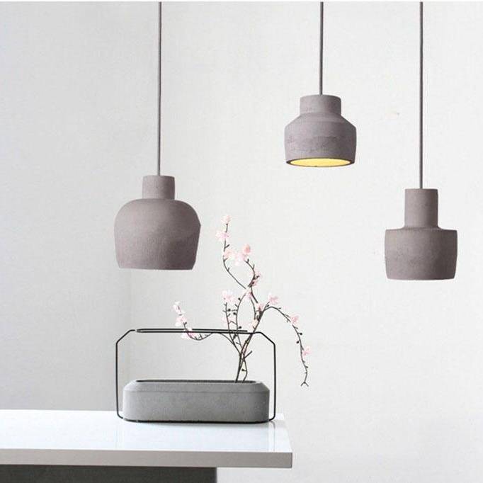 Suspension design à LED avec abat-jour arrondie en ciment