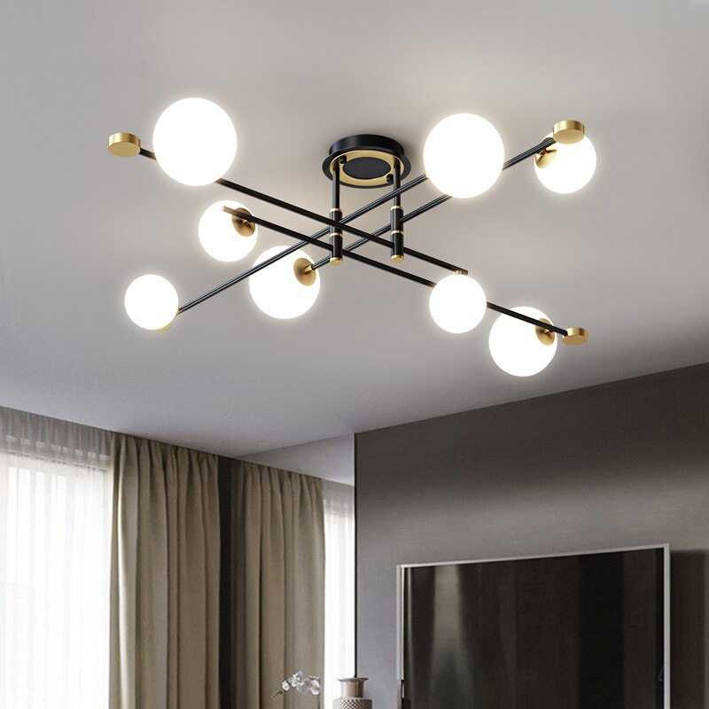 Lustre moderne LED bras croisés noirs et détails dorés Poline