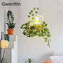 suspension moderne en cage à oiseaux avec plantes décoratives