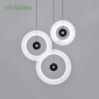 Minimalist round aluminium and glass pendant light for contemporary spaces