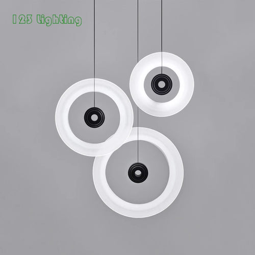 Minimalist round aluminium and glass pendant light for contemporary spaces