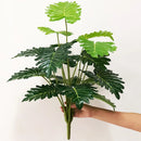 Realistic artificial tropical plants for interior decoration