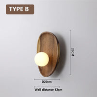 Natural wood wall light with vintage glass shade
