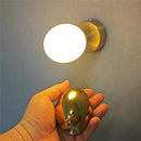 Modern egg-shaped wall light with creative minimalist design