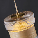 Suspension moderne en verre transparent avec détails en bois et cuivre