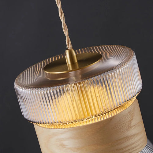 Suspension moderne en verre transparent avec détails en bois et cuivre