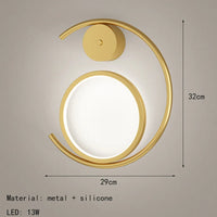Modern gold metal wall light for a minimalist atmosphere