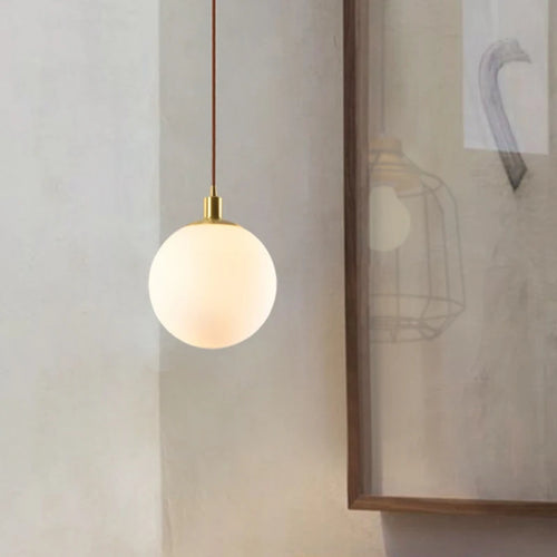 Minimalist brass pendant light with milky glass orb - vue 6 sur 9