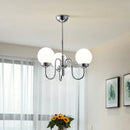 Minimalist glass and iron pendant light for medieval-inspired interiors