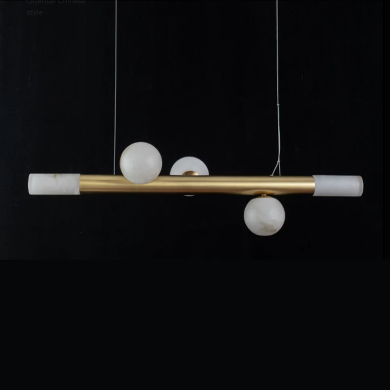 barre avec boule suspension table ronde en marbre éclairage salon de thé - vue 5 sur 7