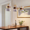 Suspension moderne en verre transparent avec détails en bois et cuivre