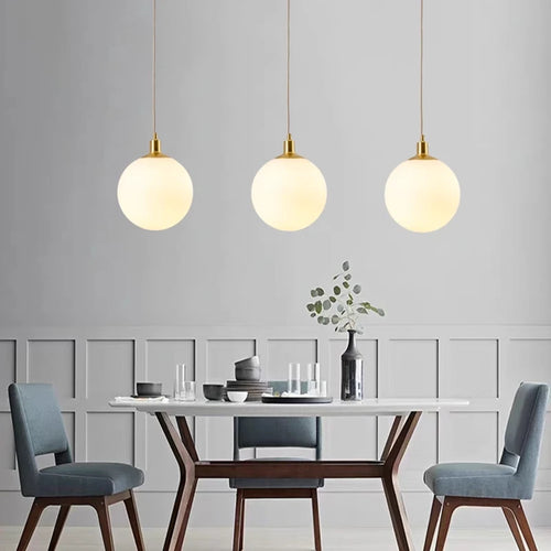 Minimalist brass pendant light with milky glass orb - vue 7 sur 9