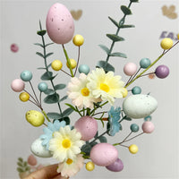 Easter decoration with artificial eggs and colourful flower bouquets