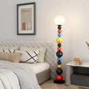 lampadaire moderne à perles colorées et abat-jour en verre
