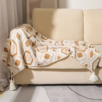 Plaid bohème géométrique à pompons pour canapé