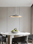 Minimalist circular pendant light with flying saucer design
