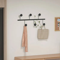 porte-vêtements nordique léger pour organisation et décoration intérieure