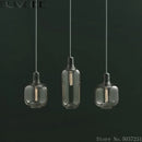 suspension en verre avec détail en marbre design industriel élégant