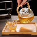Theiere verre borosilicate filtre integre anse bois design