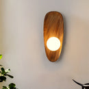 Natural wood wall light with vintage glass shade