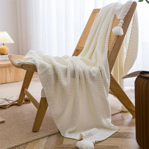 Waffle knit nordic throw with pom-poms