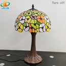 Tiffany style table lamp with decorative coloured glass flower