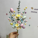 Easter decoration with artificial eggs and colourful flower bouquets