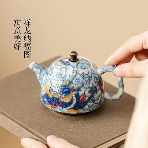 Théière chinoise en porcelaine décor traditionnel infuseur