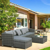 ensemble de canapés dangle de jardin en rotin avec table basse et coussins