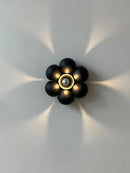 Minimalist flower shaped wall light for a soft atmosphere