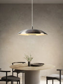 Minimalist circular pendant light with flying saucer design