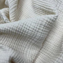plaid mousseline coton léger avec pompons bohème salon