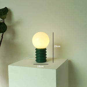 Designer glass table lamp for a warm atmosphere