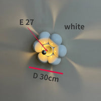 Minimalist flower shaped wall light for a soft atmosphere