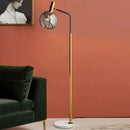 lampadaire doré et noir en métal et verre pour intérieur