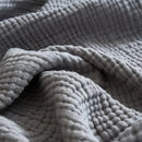 plaid coton mousseline 4 plis pompons léger salon