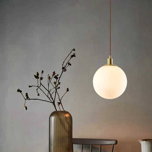 Modern minimalist brass pendant light with luminous orb - vue 3 sur 9