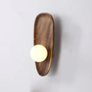 Natural wood wall light with vintage glass shade
