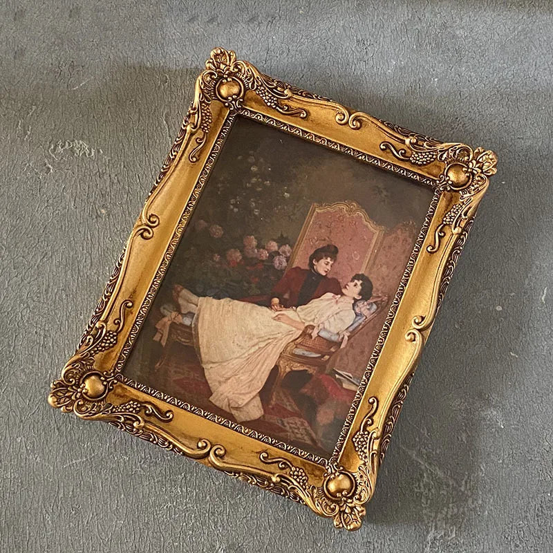 Rectangular retro gold resin photo frame. Wall relief with frame painting, combination of creative picture frame. Canvas album.
