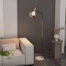lampadaire doré et noir en métal et verre pour intérieur