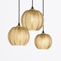 Glass pendant light with leaf pattern