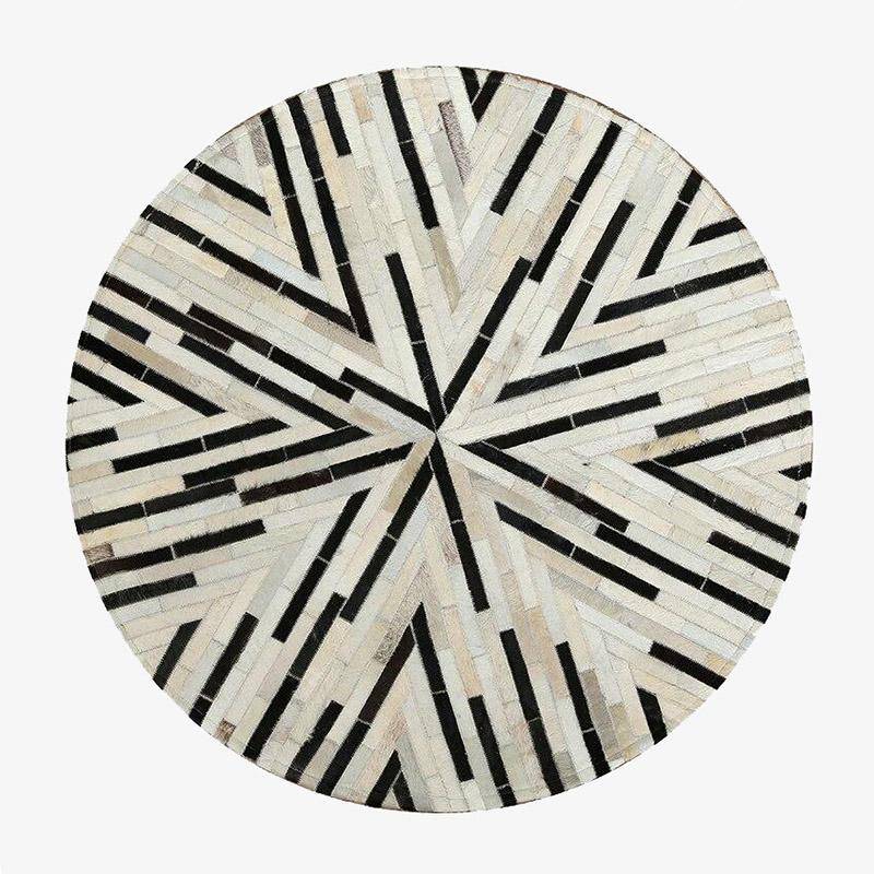 Tapis moderne rond aux formes géométriques noires et blanches Skin