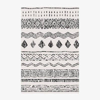 Tapis rectangle aux motifs géométriques blancs et noirs style Keecy B