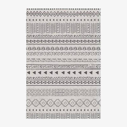 Tapis rectangle aux motifs géométriques noirs et beiges style Keecy