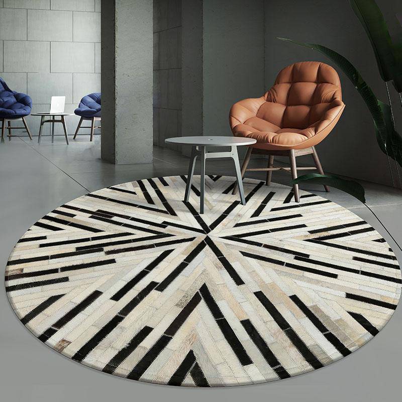 Tapis moderne rond aux formes géométriques noires et blanches Skin